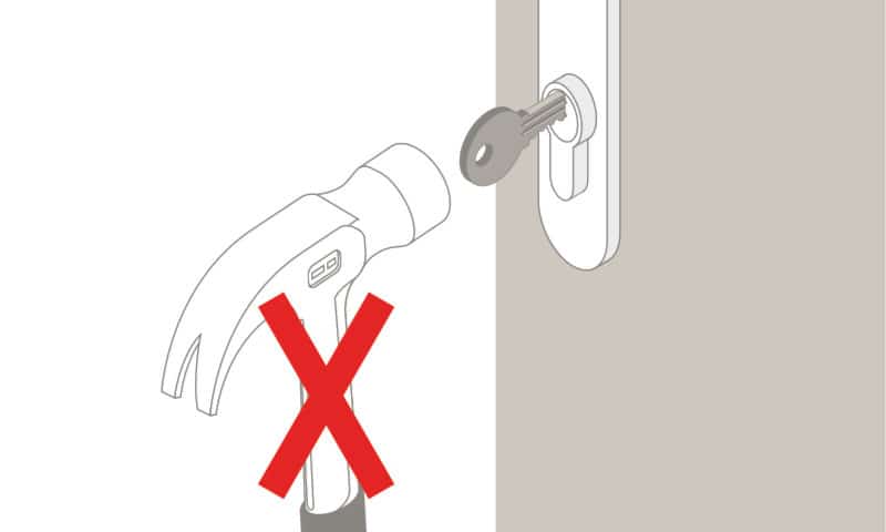 Illustration of hammer being used to force key